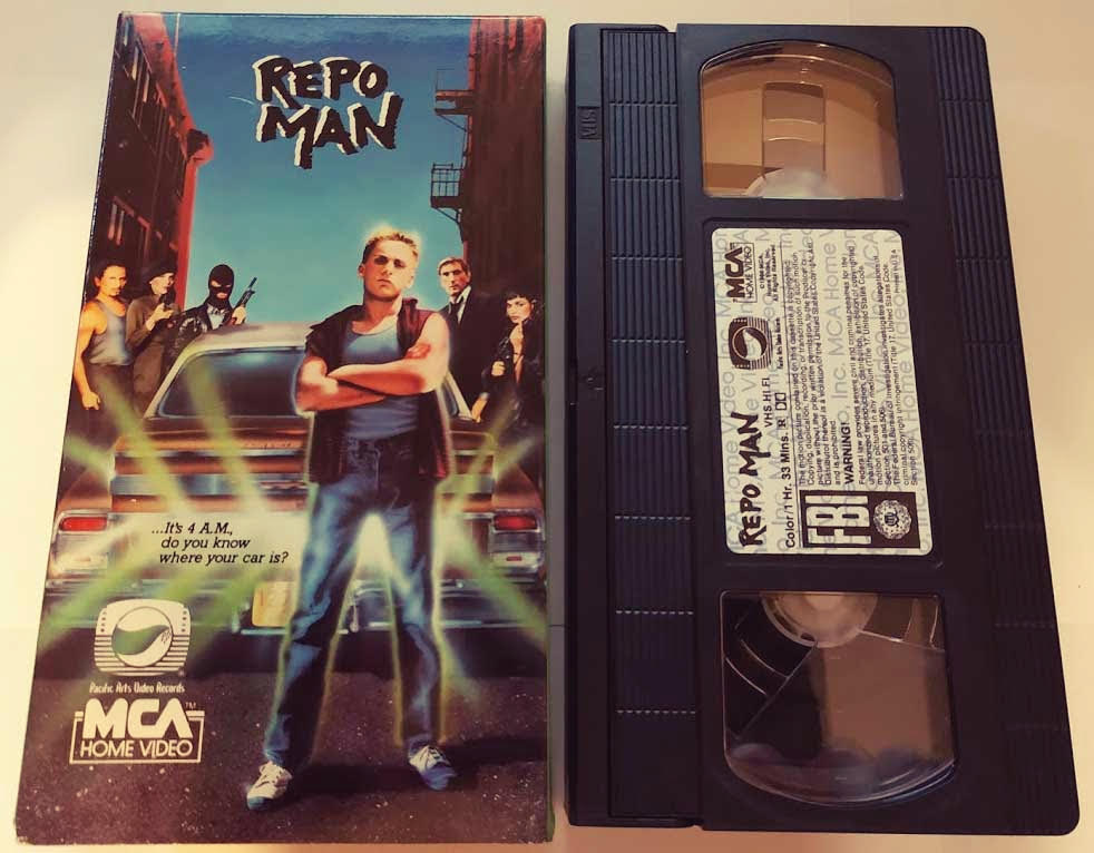 VHS tape of Repo man laying next to cover of movie