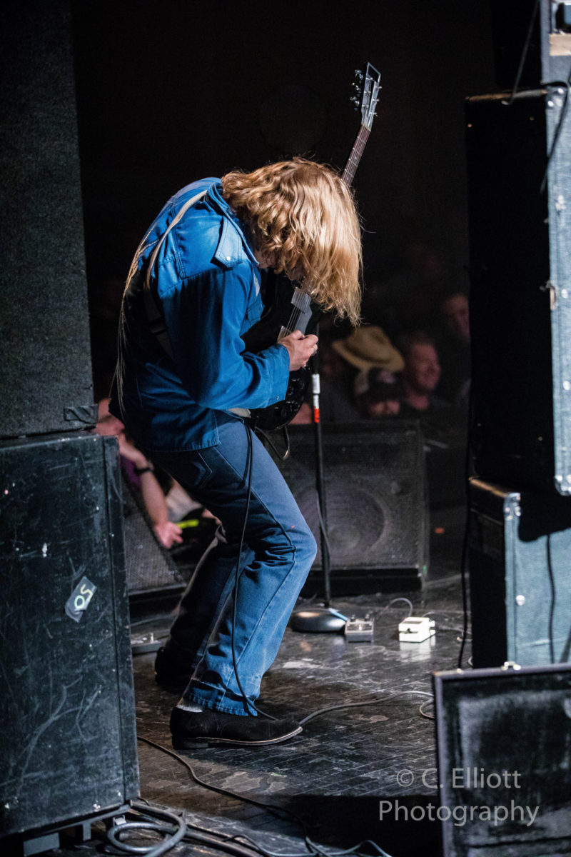 Ty Segall playing guitar onstage in theater