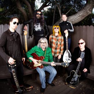 Tombstones in Their Eyes band members posing in back yard with guitars