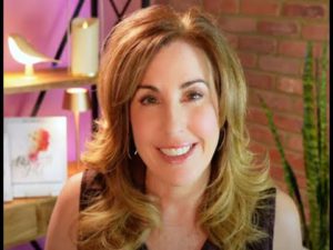 Photo of attractive middle-aged woman with long brown hair