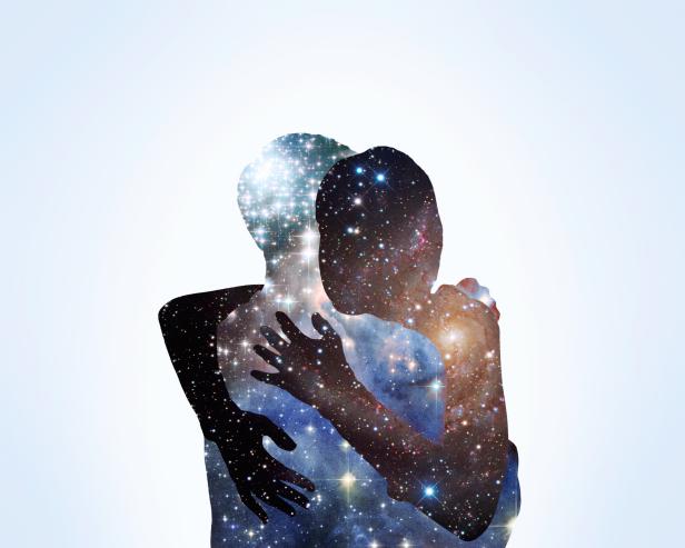 Image of two people in an embrace with the cosmos in their bodies