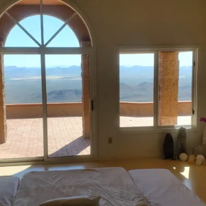 Room with arched window overlooking the desert west of Tucson