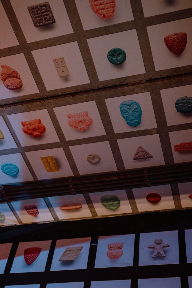 Rows of multi-colored tablets in white frames