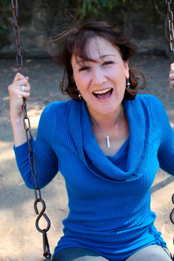 Woman in blue top on a swing
