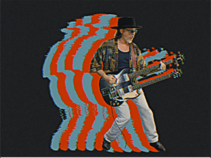 Image of Scott Holiday playing guitar with red and blue outlines behind the photo