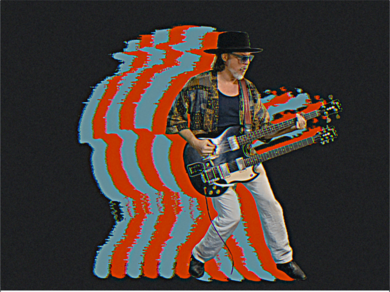 Image of Scott Holiday playing guitar with red and blue outlines behind the photo